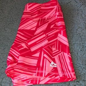 Pink and red tight athletic shorts from RBX